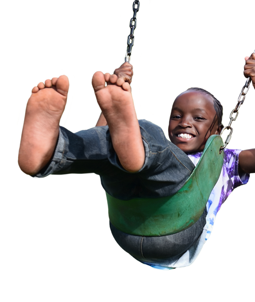 Child smiling on swing